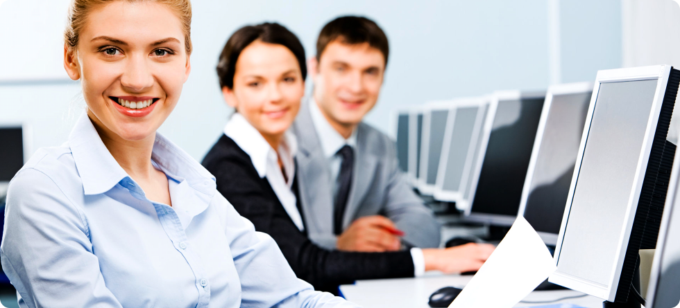 Staff sitting in front of the computer